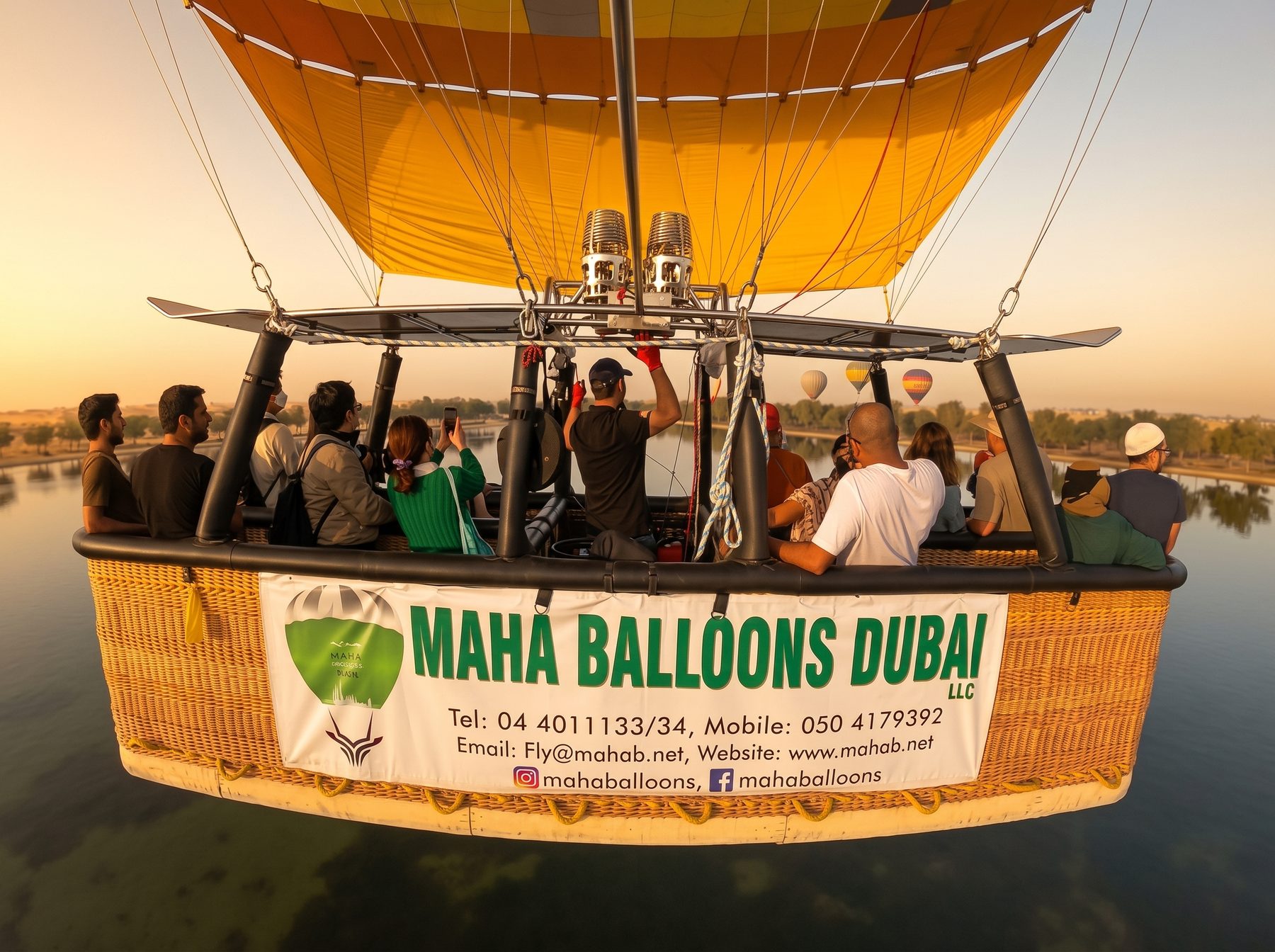 Passengers aboard a MAHA Balloon Adventures flight over the UAE at sunrise