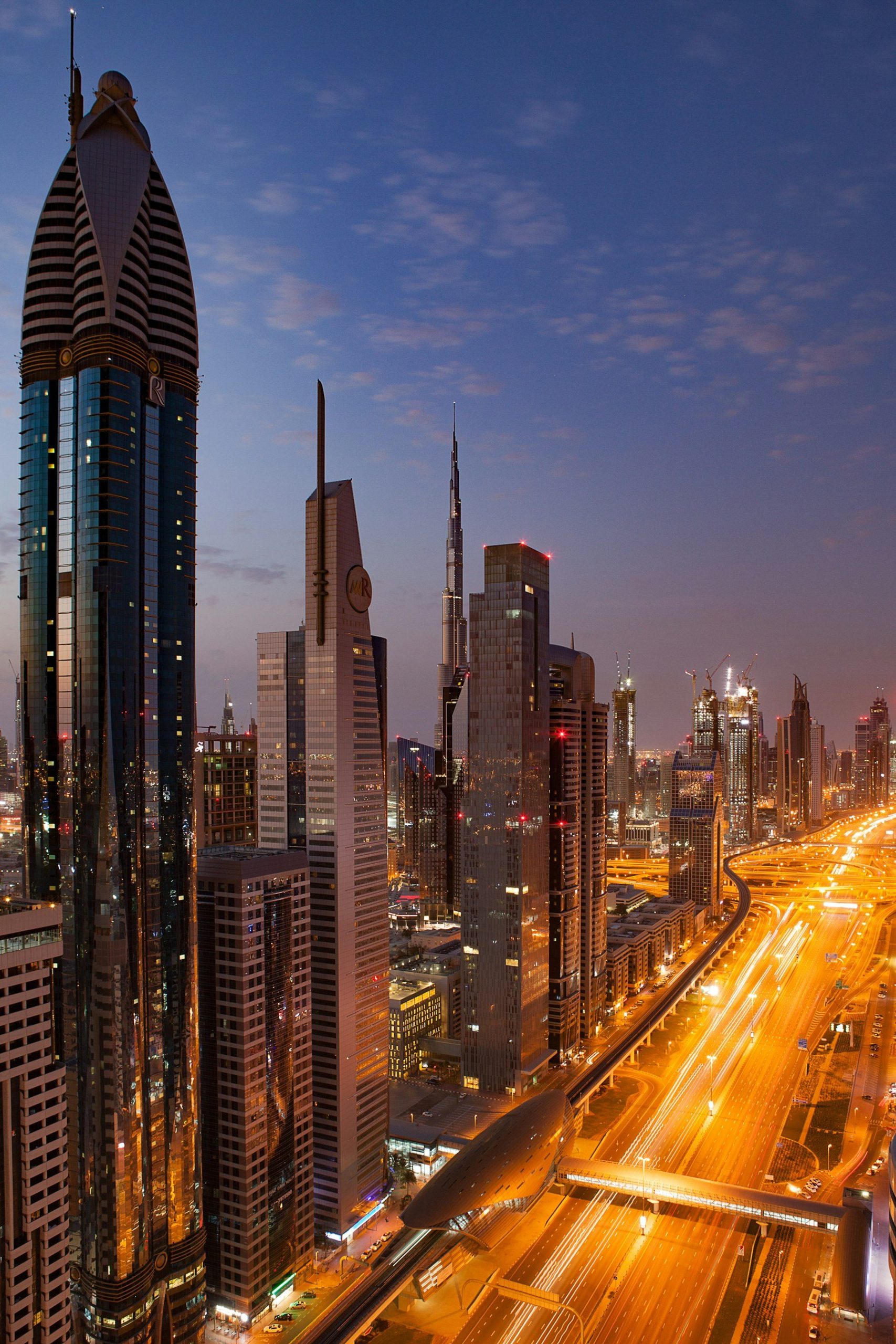 Dubai business district at dusk, where Abdulla Bin Zayed Investment Group is headquartered