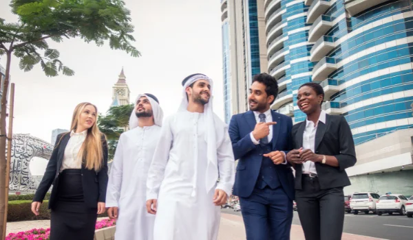 Diverse group of business professionals walking outdoors in Dubai